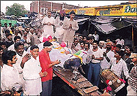 Palledars and labourers of Sector 26 join the funeral procession of a bull in Chandigarh on Wednesday.