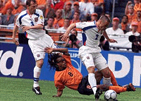Netherland's Edgar Davids (centre) challenge for the ball with Czech's Tomas Repka, right and Radoslav Latal, left, during a Group D match of the EURO 2000 soccer championships in the ArenA Stadium in Amsterdam on Sunday.