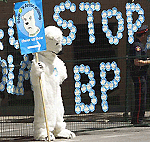 A protester dressed as a polar bear stands outside the World Petroleum Congress barricade where stickers were placed on Tuesday in Calgary in protest of BP�s Arctic drilling. 