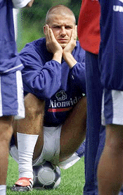 England midfielder David Beckham listens to manager Kevin Keegan during a training session for the European Championship at their camp in Spa June 14