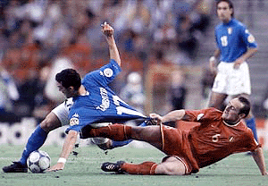 Italy's Gianlyca Zambrotta and Belgium's Yves Vanderhaegue challeng the ball during a Group B match of the EURO 2000 soccer championships between Italy and Belgium at the King Baudouin Stadium in Brussels on Wednesday