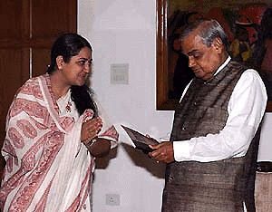 Prime Minister Atal Behari Vajpayee receiving a report on "Rape � a legal study" 