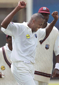 Courtney Walsh of the West Indies celebrates taking the wicket of England's Michael Atherton during the first test at Edgbaston on Thursday