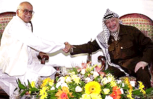 Palestinian leader Yasser Arafat shakes hands with Union Home Minister L.K. Advani (left) during their meeting at Arafts office in Gaza City on Saturday. At the meeting they discussed the latest negotiation of the peace process with President Clinton at the White House in Washington on June 15