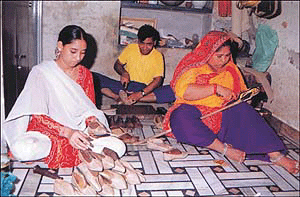 Shanti and her children make  juttis in Patiala