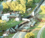 A Norfolk Southern westbound freight train, en route from Peru to Logansport, Ind., lies where multiple cars derailed Monday, June 19, 2000, in New Waverly, Ind. More than 20 of the train's 106 cars derailed, causing more than a dozen area homes to be evacuated due to the potential hazard of flammable cargo