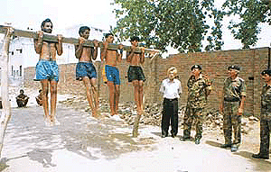 Candidates undergoing the chin-up physical test.