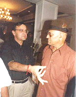 Union Information and Broadcasting Minister Arun Jaitley exchanges notes with "Mogambo" Amrish Puri at a function organised by the BJP Film Cell in Mumbai yesterday night