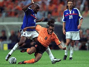Edgar Davids of The Holland is fouled by Patrick Viera of France (left) during the EURO 2000 Soccer Championships group D match between The Netherlands and France at the ArenA in Amsterdam on Wednesday