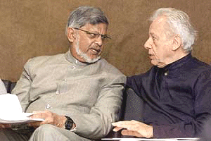 Arun Gandhi, grandson of Mahatma Gandhi (left), talks with the Director of Brazil's University of Peace, Pierre Weill, during a global forum sponsored by UNESCO in Brasilia, Brazil, on Wednesday