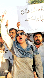 Former Pakistani film star-turned-politician Musharat Shaheen raises slogans against ousted Prime Minister Nawaz Sharif and condemns his statement on Kargil in Islamabad on Wednesday