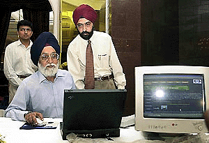 India�s Chief Election Commissioner, Dr M.S. Gill, inaugurates a new website www.getridofglasses.com in New Delhi on Friday. The website, which promotes laser vision correction, aims to bring eye health care closer to the people. The relatively low cost of laser vision correction in India is attracting foreign patients. �AFP