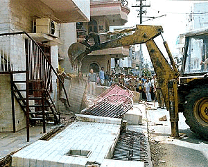 Residential area of west Patel Nagar where the people has made illigal construction being demolished by the MCD on friday