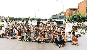 Residents of Sector 46-D block the road to show their resentment against the indifferent attitude of The Municipal Corporation of Chandigarh on Sunday