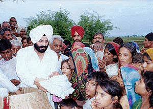 Chairman of the All-India Anti Terrorist Front M.S. Bitta talks to a child who was injured in the recent Maipur massacre at Gaya Hospital in Bihar on Friday