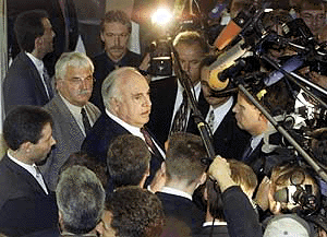 Former German Chancellor Helmut Kohl speaks to the media as he leaves a parliamentary committee in Berlin on Thursday, investigating his Christian Democratic party's financing scandal