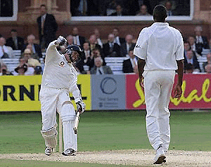 England's Dominic Cork celebrates his run