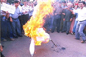 Members of Kashmiri Hindu Samiti (Karnataka) burning an effigy of Jammu and Kashmir Chief Minister Farooq Abdullah in Bangalore on Sunday, in protest against the autonomy resolution passed by the Assembly