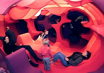 Visitors sit and admire the Fantasy Landscape designed by German Bayer AG in 1970 for a furniture fair, which has been partially reconstructed and is on display in the newly-opened Vitra Design Museum in Berlin on Sunday