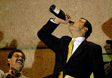 MEXICO CITY : National Action Party (PAN) presidential candidate Vicente Fox drinks from a bottle of champagne.