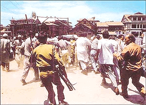 Police lathi charge demonstrators led by Mrs Mehbooba Mufti near the office of the Deputy Commissioner in Srinagar on Monday
