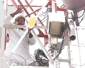Municipal Councillor Atif Mohammad Khan who climbed the Jogab Tower in the Jamia Milia University area in New Delhi on Monday, where he threatened to commit suicide if the MCD demolition drive did not stop in the Toba colony area