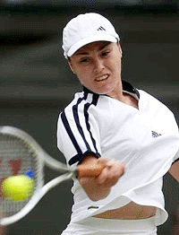 Switzerland's Martina Hingis plays a forehand return during her quarter final match against Venus Williams at the Wimbledon Tennis Championships on Tuesday