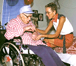 Mary Anderson, a Carnegie nursing home volunteer, talks to Ben Holcomb is his room on Monday, in Carnegie, Oklahoma, during his 111th birthday party. Holcomb is regognised by the Guinness Book of Records as the world's oldest man. Until he was in his late 90s, he farmed hundreds of acres of land, including about 320 acres he owned near Apache.
