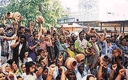 Residents of kidwai Nagar carrying empty pitchers hold a demonstration against water shortage in Ludhiana on Friday Photo by Rajesh Bhambi