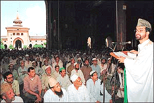 Kashmir's chief Muslim cleric, Muulvi Umar Farooq (R), addresses a religious gathering before Friday prayers in Srinagar on Friday at the Grand Mosque Jamia Masjid. Farooq told the gathering that the solution to the dispute over Kashmir lies only in trilateral talks between India, Pakistan and representatives of Kashmir and that autonomy for the troubled state will not resolve the issue