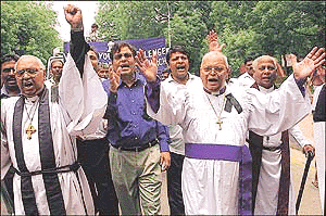 Christians shout anti-government slogans near the parliament in New Delhi on Saturday to protest against the recent attacks on Christians and churches in India. The demonstrators demanded Prime Minister Atal Bhehari Vajpayee's government to take action against the pro Hindu militant organizations over Christians attacks