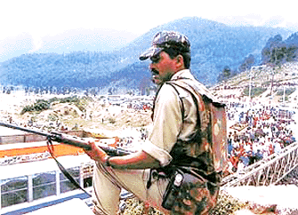 Securityman on guard at Pahalgam as thousands of tourists pour in. Pahalgam is also the base camp for the Amarnath Yatra which begins on Thursday