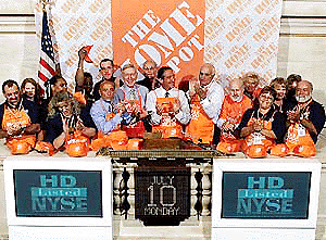 New York Stock Exchange Chairman Richard Grasso, third from left front, Home Depot Chairman Bernie Marcus, left centre, Home Depot CEO and President Arthur Blank, centre, and Co-Founder Ken Langone, right centre, applaud after ringing the opening bell at the NYSE on Monday, celebrating their 1000th store.� AP/PTI photo