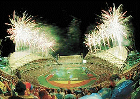 Fireworks erupt over the main stadium for the Sydney 2000 Olympics during the unofficial opening day event March 6