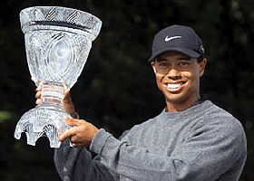 Tiger Woods of the U.S. raises the trophy after winning the JP McManus Invitational Pro Am 2000 at Limerick Golf Club, Ireland on Wednesday