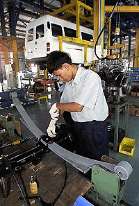 A Vietnamese worker works on an assembly line at an automobile factory by the US-giant Ford in the northern province of Hai Duong on Friday. The USA and Vietnam signed a landmark trade agreement a quarter of a century after the end of the Vietnam War. � AFP photo