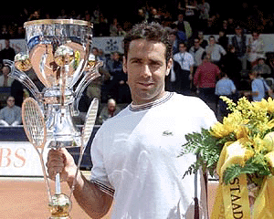 Spain's Alex Corretja poses after his victory in the final match against Argentina's Mariano Puerta, at the UBS Open in Gstaad, Switzerland, on Monday
