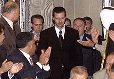 Bashar Assad is greeted by Syrian parliament members in Damascus