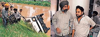 (Left) Police personnel and a few good Samaritans help in retrieving the ill-fated van from the canal; (right) Satnam Singh, who lost three family members during the accident, being consoled by a relative. � Photo by Rajesh Bhambi