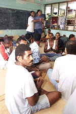 Supporters of coup leader George Speight gather in the a class room of the Kalabu Fijian school in Suva, Fiji on Thursday. Coup supporters left their previous camp at Fiji's Parliament House and moved into the school grounds Wednesday. The school grounds were taken over because of disapproval of the list of the proposed interim cabinet