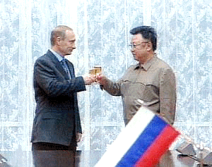 President Vladimir Putin and North Korean leader Kim Jong Il toast during their meeting in Pyongyang on Wednesday in this image from television. Vladimir Putin held a summit with Kim Jong Il shortly after he arrived in Pyongyang on Wednesday