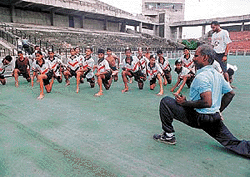 Trainees of the Ramesh Chander Memorial Hockey Academy receiving tips from Dr Kannan Pugazhendi, consultant in sports medicine from ASPN at the Sector 42 Hockey stadium in Chandigarh on Thursday 
