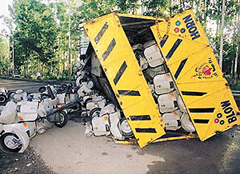 An overturned scooter-loaded truck which disrupted traffic on the Chandigarh-Ambala highway for more than 20 hours at Zirakpur on Wednesday night. � Tribune photo by Parvesh Chauhan 