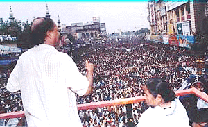Trinamool Congress supremo Mamta Banerjee looks on as Calcutta Mayor Subrato Mukherjee speaks at a rally organised by the party in Calcutta on Friday