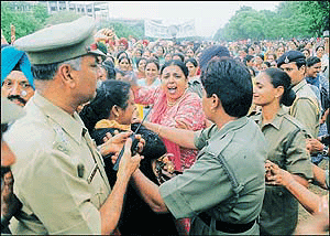 Nurses and para-medical employees of Punjab jostle with police personnel to break the cordon in Chandigarh on Thursday.