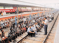 Forwarding agents block tracks at the local railway station to protest against the lack of facilities at the station 