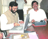 Mr Prakash Javadekar submits working group report on information technology for masses to Union Information and Broadcasting Minister Pramod Mahajan in New Delhi on Saturday