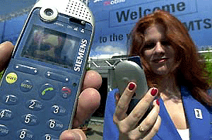 A prototype video handy working with UMTS (Universal Mobile Telecommunications Systems) is displayed during a promotion rally in Mainz on Tuesday. It's the second day the German Telecommunication Regulation Office auctions off mobile phone frequency licences for the upcoming UMTS standard. � Reuters