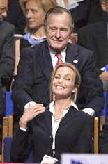 Actress Bo Derek touches the hand of former President George Bush at the Republican National Convention in Philadelphia on Wednesday
