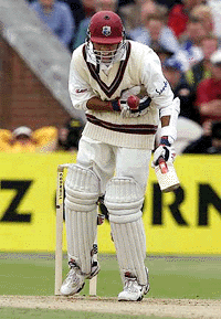 West Indies batsman Nawaz Sarwan holds his chest after being struck by a delivery from England bowler Craig White, during the second day of the Third Test at Old Trafford, Manchester, north-western England, on Friday